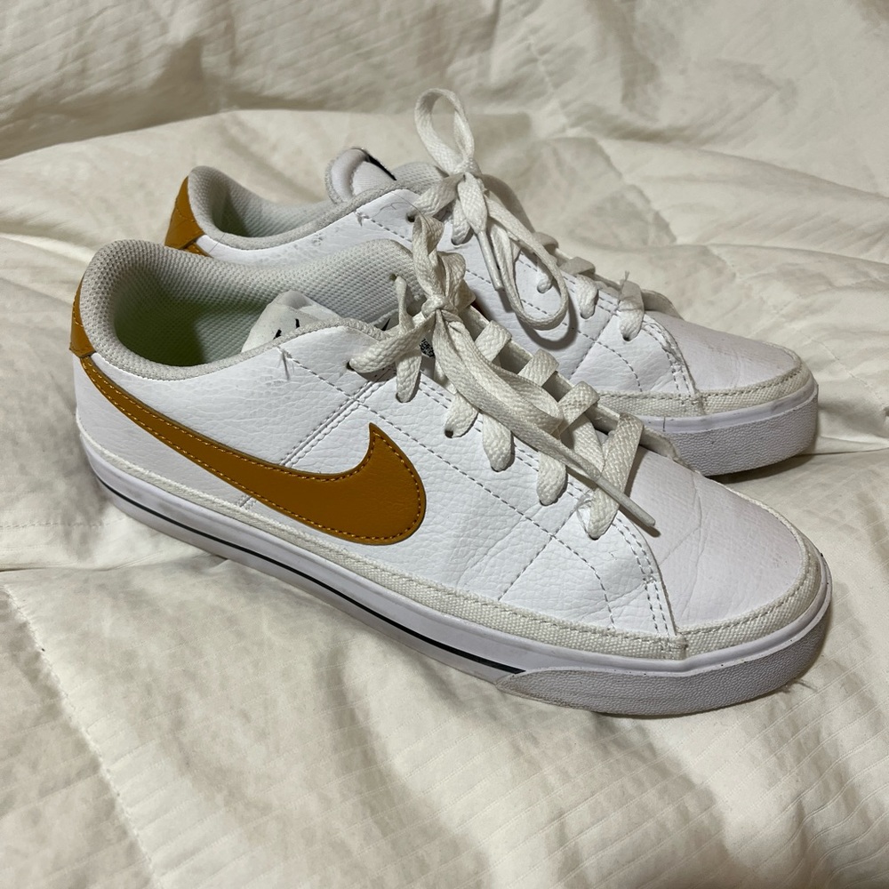 Women’s Nike sneakers, white with brown swoosh